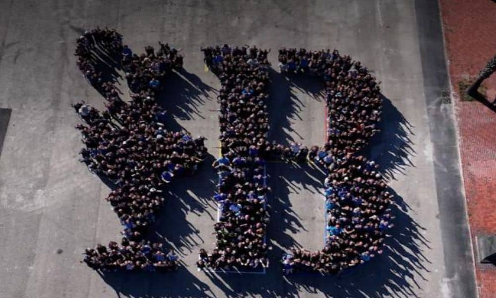 800 volunteers create a human mosaic with the America's Cup Sailing logo in Barcelona